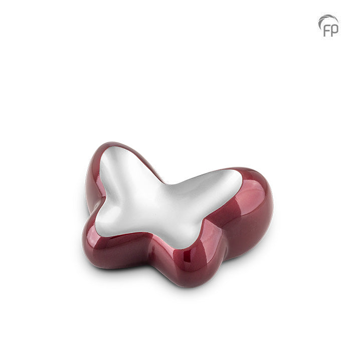 Deze orginele vlindervormige metalen mini urn is gemaakt van hoogwaardige materialen zoals messing en aluminium, voorzien van een laklaag die het product zijn glans en langdurige bescherming geeft.