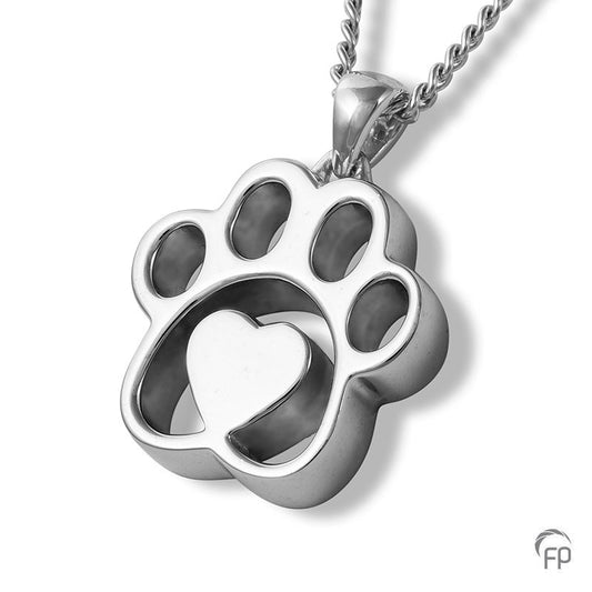 Deze zilveren 925 sterling ashanger met pootafdruk en hartje kenmerkt zich door het fraai en speels ontworpen karakter. Dit gedenksieraad kan met as en ook met haar van je huisdier gevuld worden.