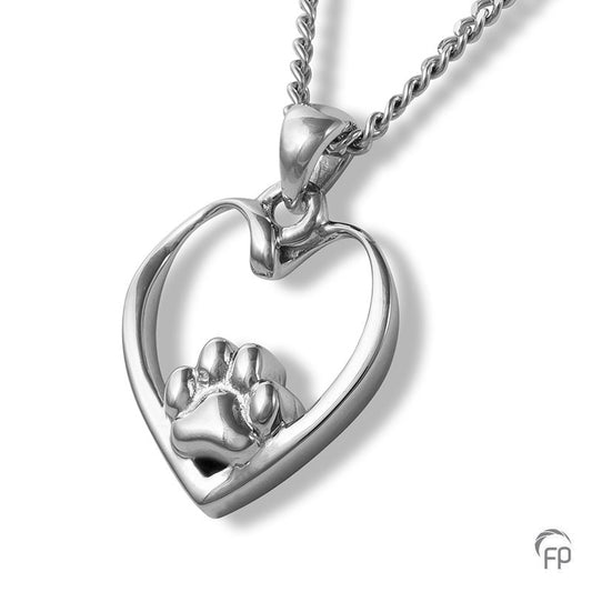 Deze zilveren 925 sterling ashanger met pootafdrukje en hartje kenmerkt zich door het fraai en speels ontworpen karakter. Dit gedenksieraad kan met as en ook met haar van je huisdier gevuld worden.