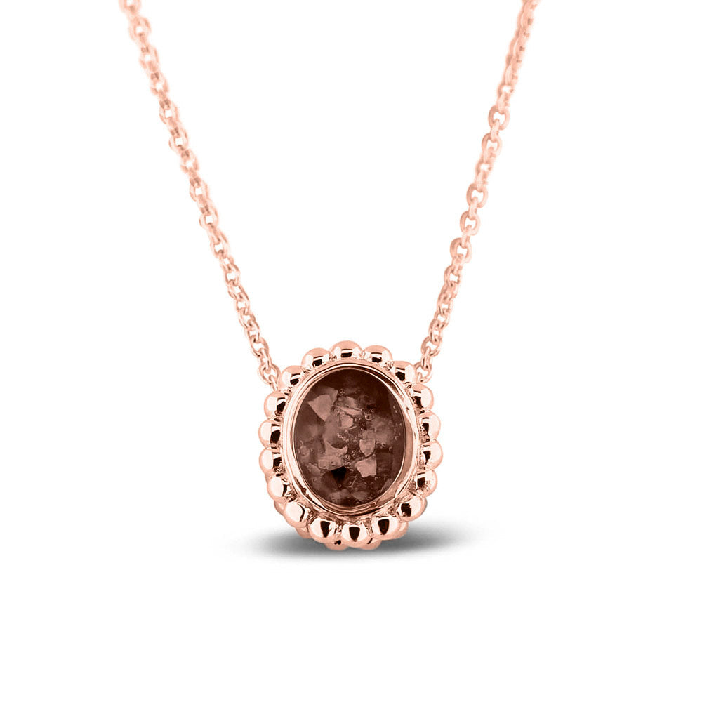 Ashanger, gedenksieraad, waar as en haar in verwerkt wordt.brown