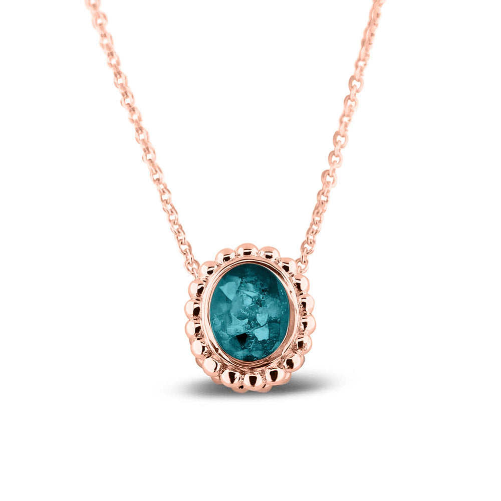 Ashanger, gedenksieraad, waar as en haar in verwerkt wordt.turquoise