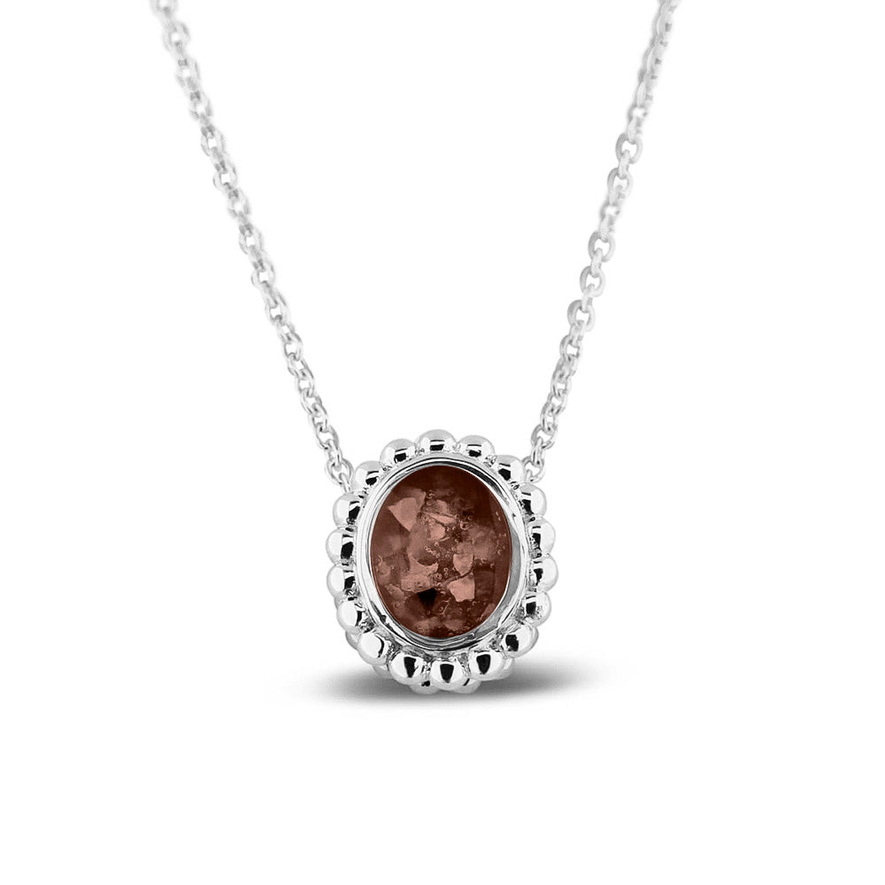 Ashanger, gedenksieraad, waar as en haar in verwerkt wordt.brown