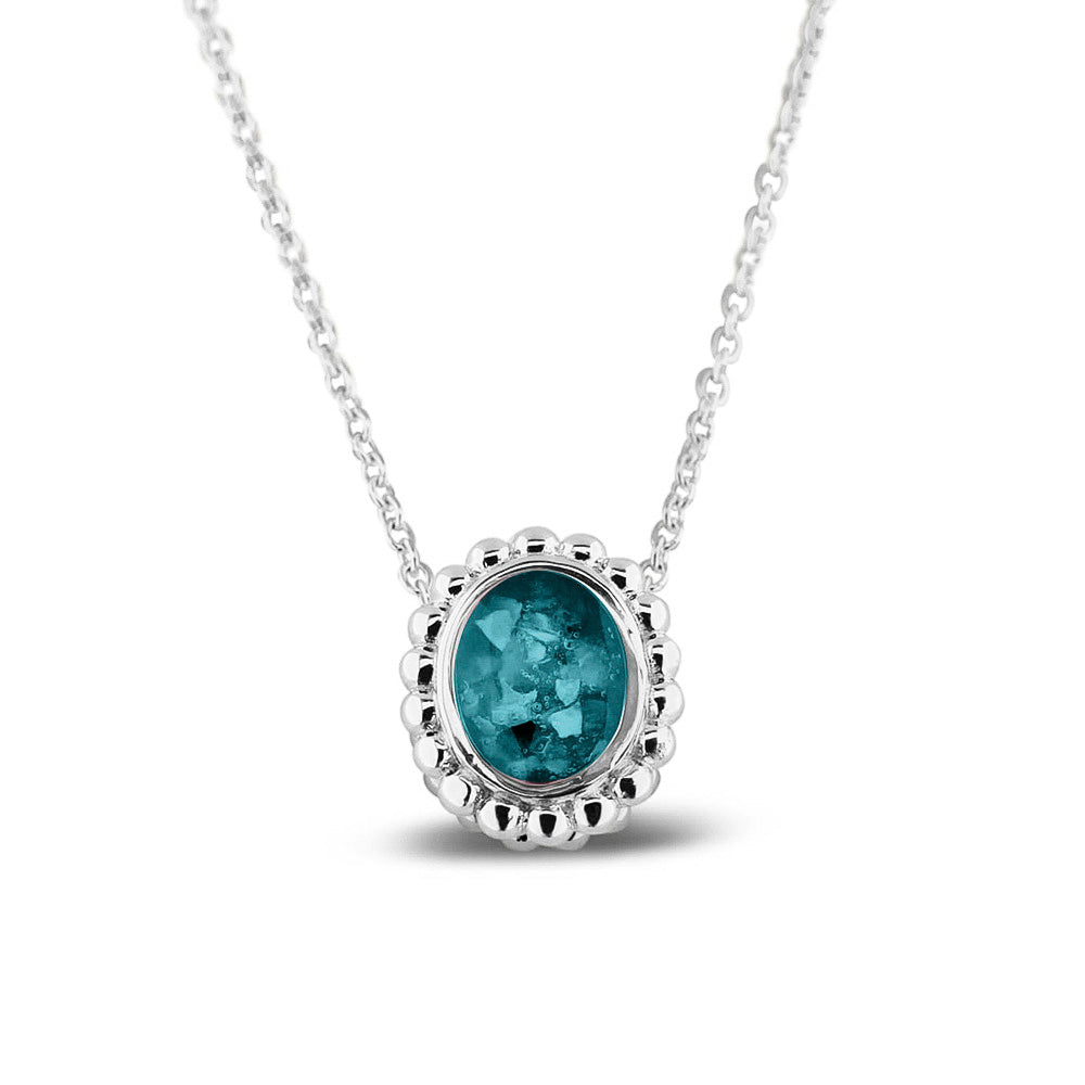 Ashanger, gedenksieraad, waar as en haar in verwerkt wordt.turquoise