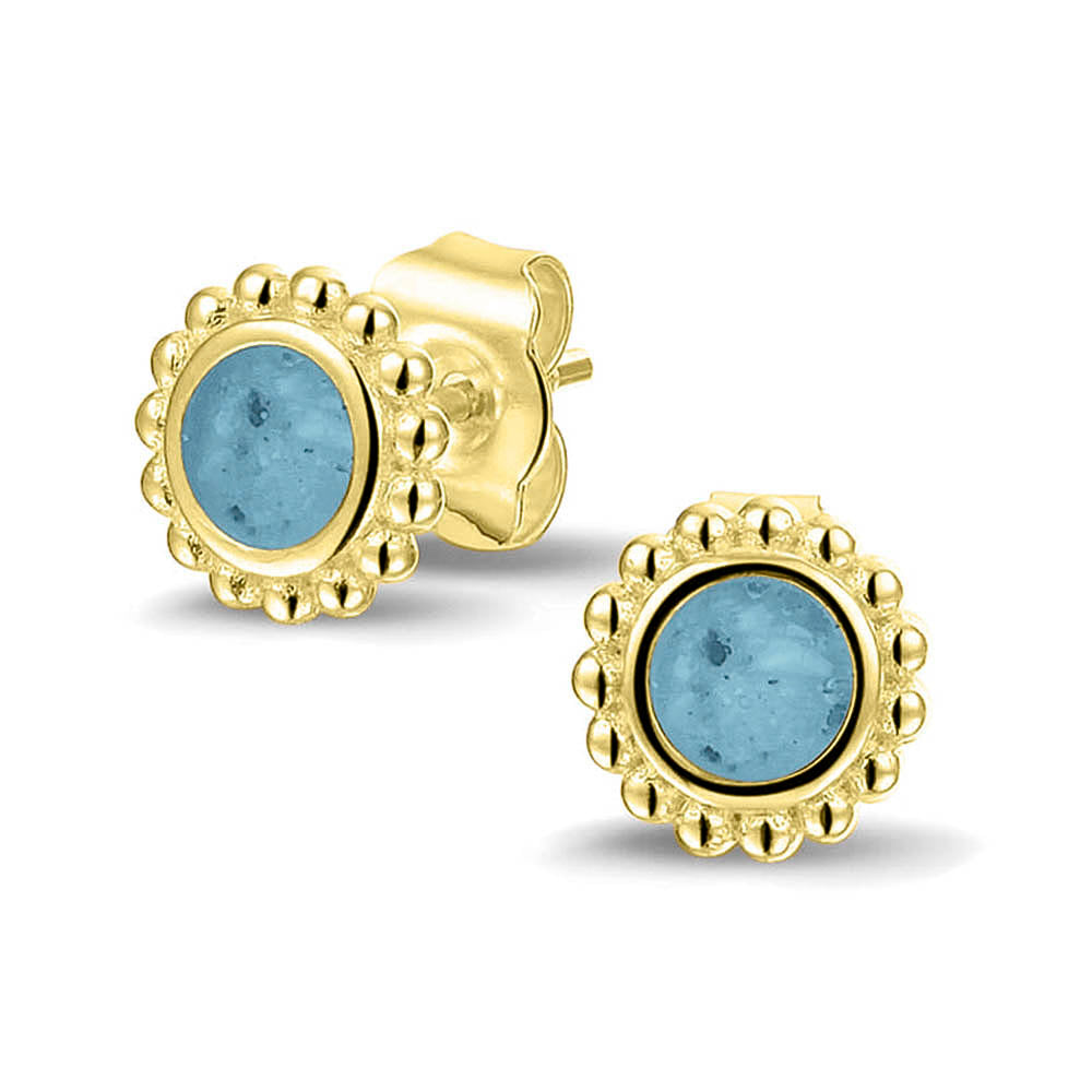 Twee stuks ronde oorstekers 8 mm zichtbaar gevuld met as of haar. Baby