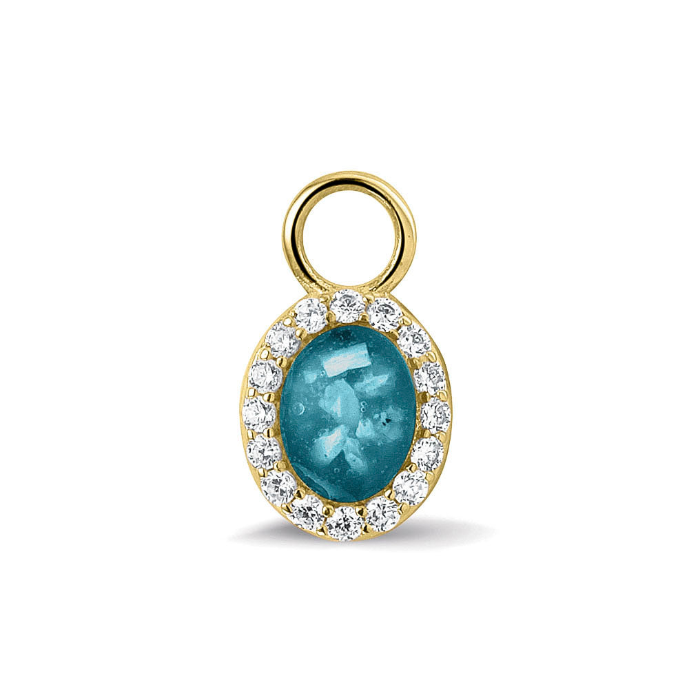 Ovaal gevormde oorhangers, 18 mm lang rondom afgewerkt met zirkonia's, aan de voorzijde zichtbaar gevuld met as of haar. Turquoise