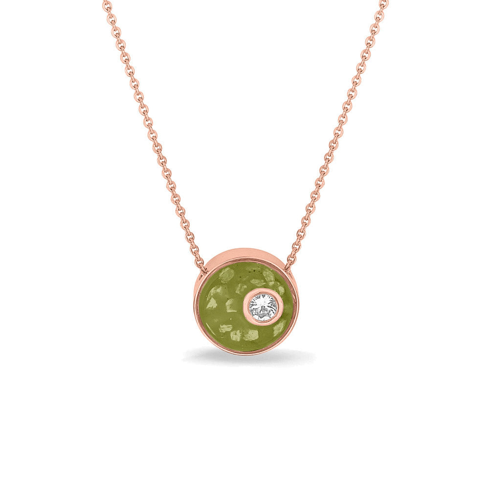 Ashanger rond, gedenksieraad, waar as en haar in verwerkt wordt. Olive