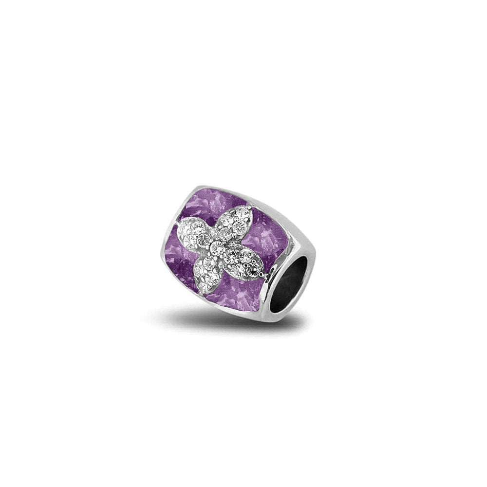 Asbedel met  zirkonia's, aan beide zijdes in twee compartimenten zichtbaar gevuld met as of haar. Purple