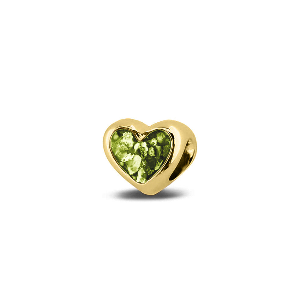 Hartvormige asbedel, aan beide zijdes zichtbaar gevuld met as of haar. Het vullen en sealen met onze speciale hars met een keuze in 20 kleuren, wordt in onze ambachtelijke edelsmederij gedaan. Green