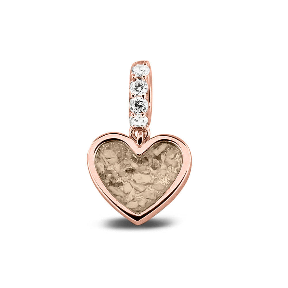 Hartvormige asbedel, het hangoog aan de buitenrand afgewerkt met zirkonia's die aan de voorzijde zichtbaar gevuld wordt met as of haar met een keuze in 20 kleuren. Transparent