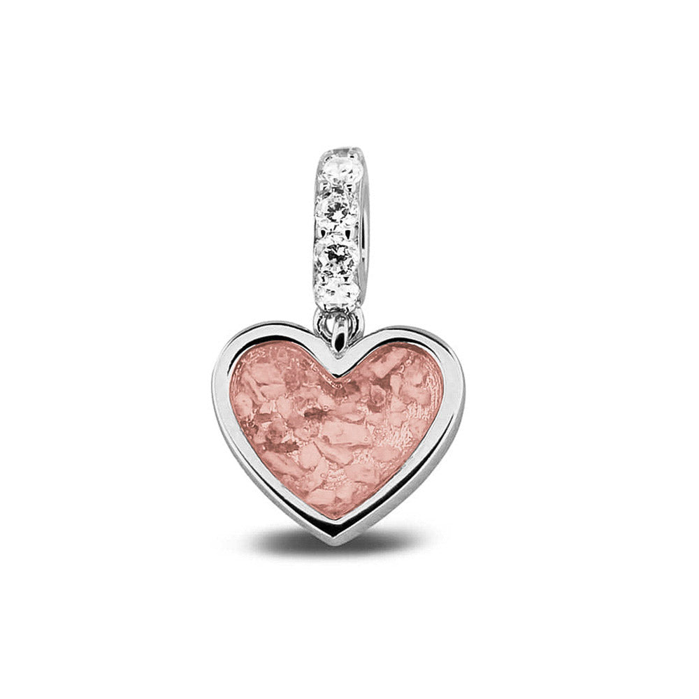 Hartvormige asbedel, het hangoog aan de buitenrand afgewerkt met zirkonia's die aan de voorzijde zichtbaar gevuld wordt met as of haar met een keuze in 20 kleuren. Blush