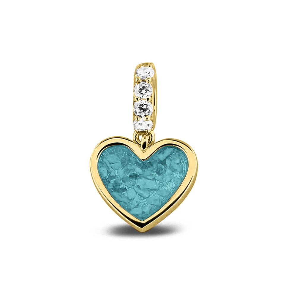 Hartvormige asbedel, het hangoog aan de buitenrand afgewerkt met zirkonia's die aan de voorzijde zichtbaar gevuld wordt met as of haar met een keuze in 20 kleuren. Aqua