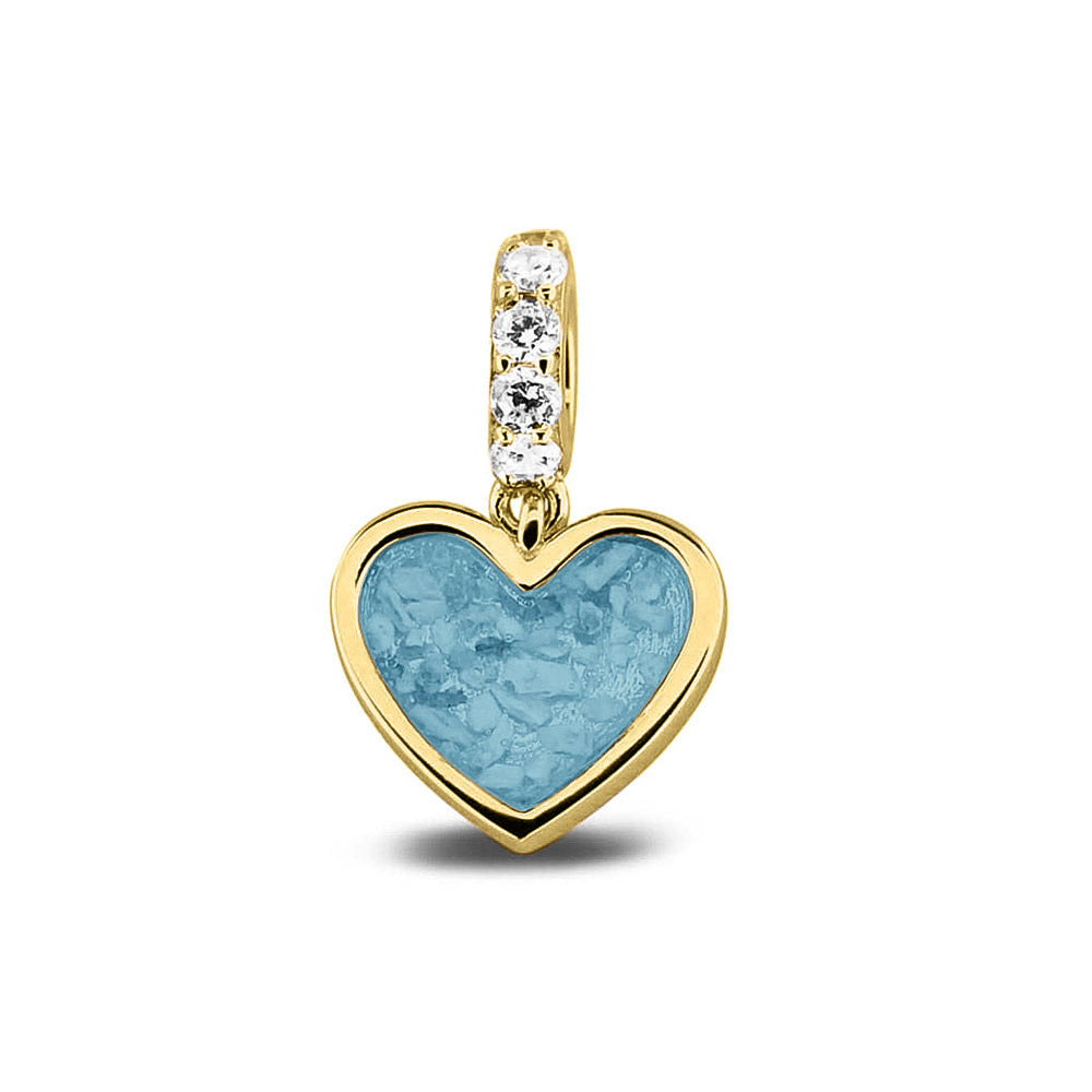 Hartvormige asbedel, het hangoog aan de buitenrand afgewerkt met zirkonia's die aan de voorzijde zichtbaar gevuld wordt met as of haar met een keuze in 20 kleuren. Baby