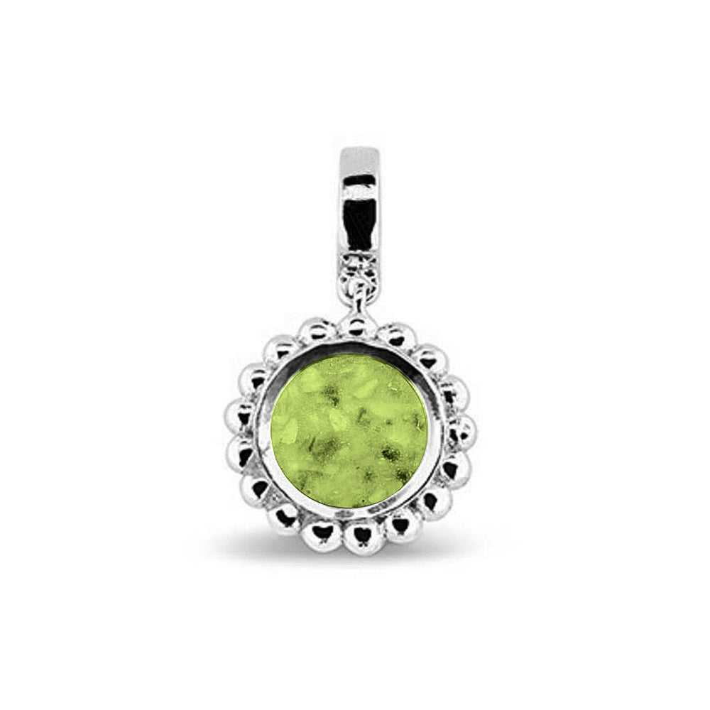 Asbedel die aan de voorzijde zichtbaar gevuld wordt met as of haar. Het vullen en sealen met een keuze in 20 kleuren, wordt in onze ambachtelijke edelsmederij gedaan. Green