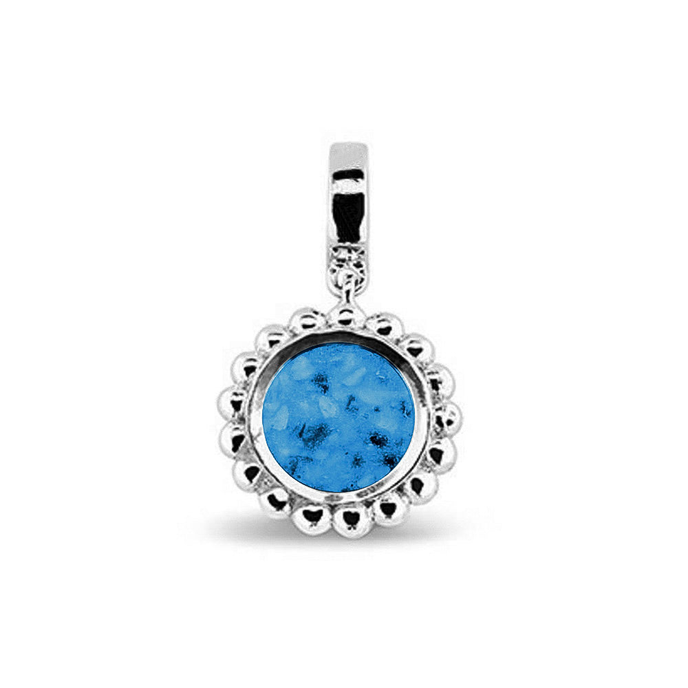 Asbedel die aan de voorzijde zichtbaar gevuld wordt met as of haar. Het vullen en sealen met een keuze in 20 kleuren, wordt in onze ambachtelijke edelsmederij gedaan. Marine