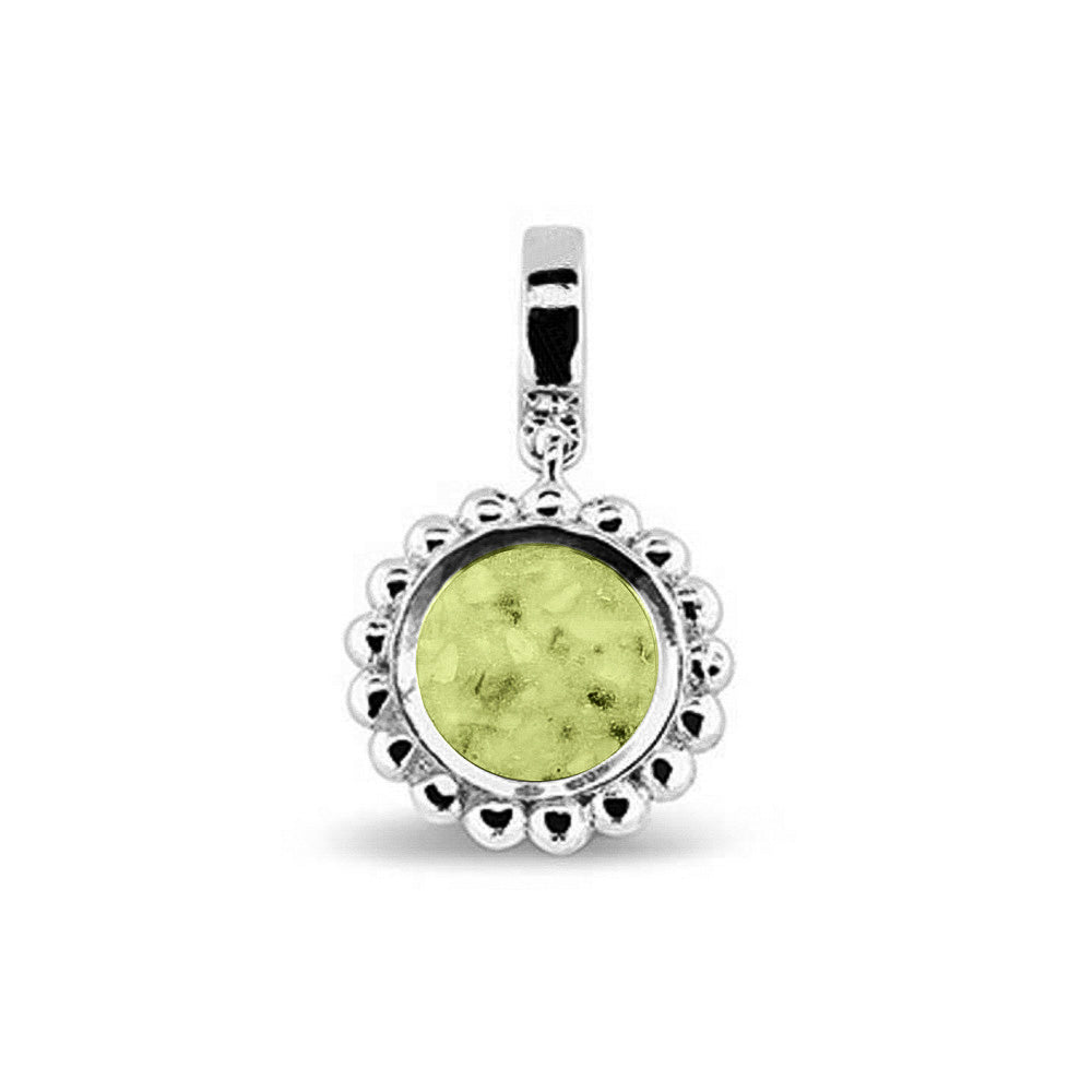 Asbedel die aan de voorzijde zichtbaar gevuld wordt met as of haar. Het vullen en sealen met een keuze in 20 kleuren, wordt in onze ambachtelijke edelsmederij gedaan. Olive