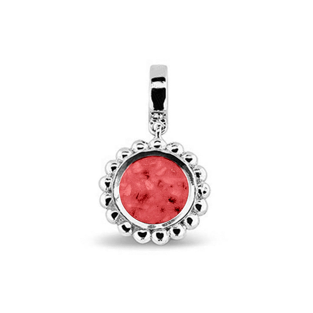 Asbedel die aan de voorzijde zichtbaar gevuld wordt met as of haar. Het vullen en sealen met een keuze in 20 kleuren, wordt in onze ambachtelijke edelsmederij gedaan. Red