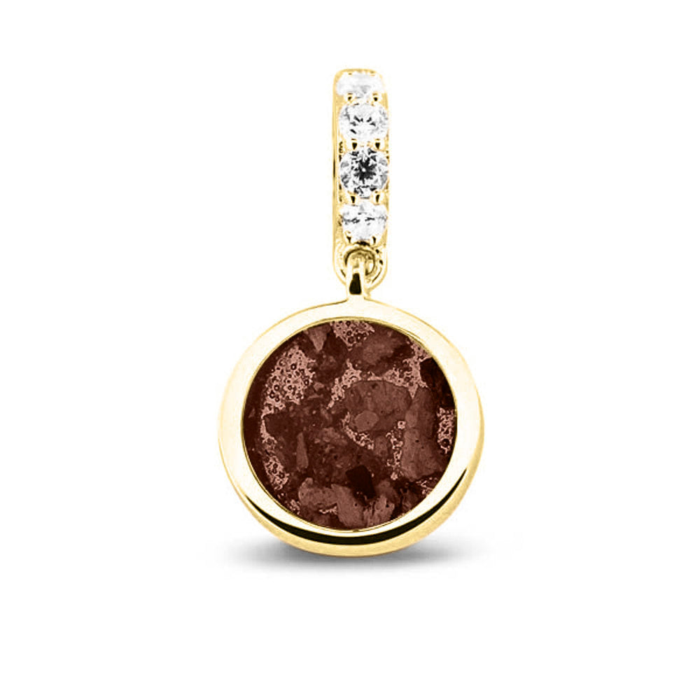 Asbedel rond subtiel design , het hangoog aan de buitenrand afgewerkt met zirkonia's, die aan de voorzijde zichtbaar gevuld wordt met as of haar met een keuze in 20 kleuren. Brown