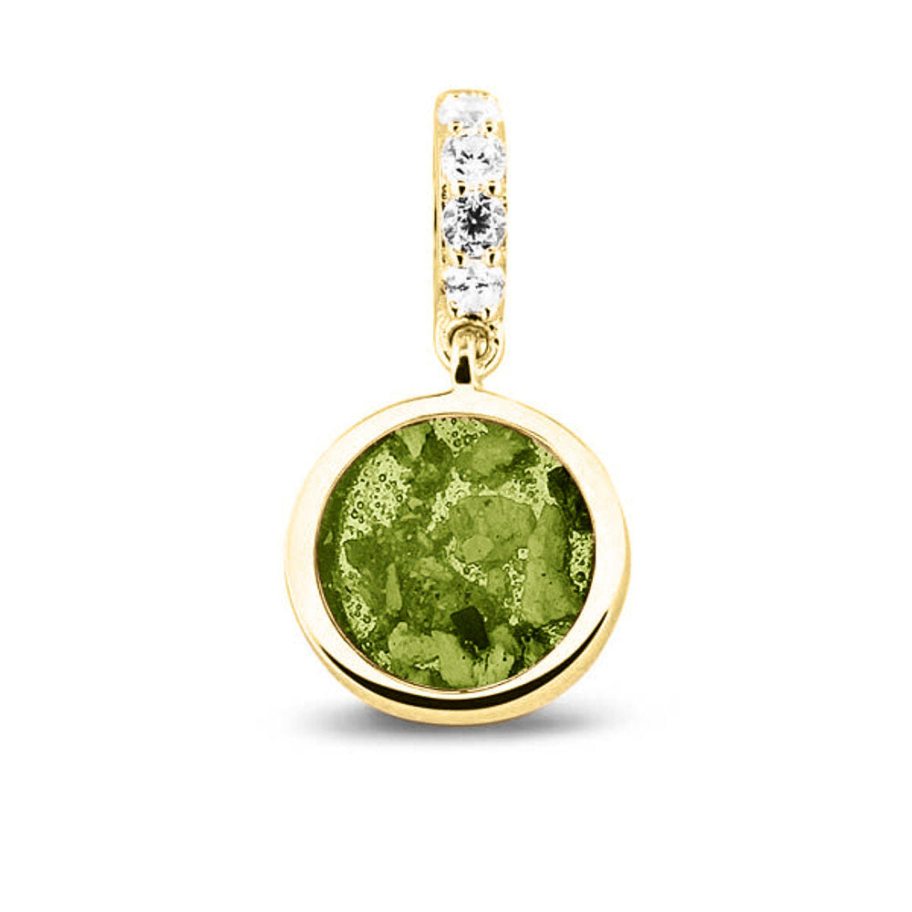 Asbedel rond subtiel design , het hangoog aan de buitenrand afgewerkt met zirkonia's, die aan de voorzijde zichtbaar gevuld wordt met as of haar met een keuze in 20 kleuren. Green