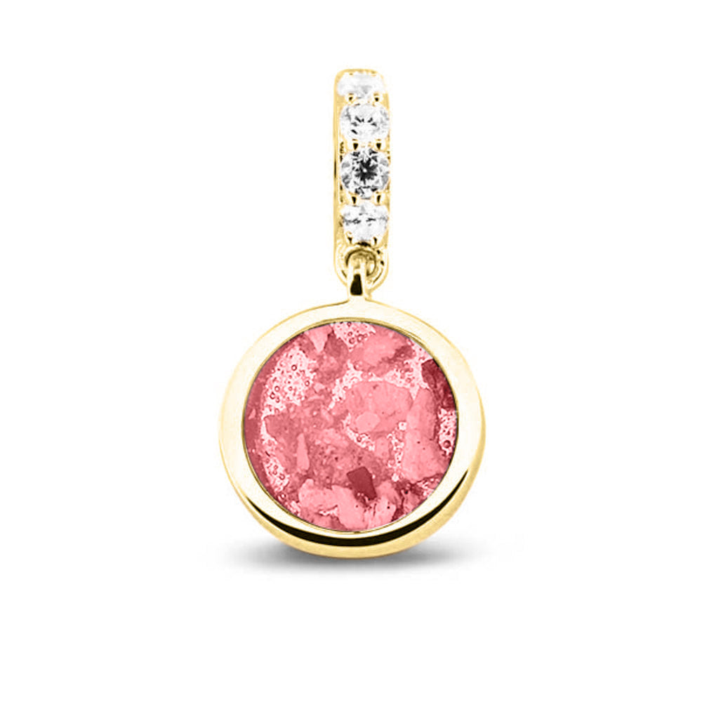 Asbedel rond subtiel design , het hangoog aan de buitenrand afgewerkt met zirkonia's, die aan de voorzijde zichtbaar gevuld wordt met as of haar met een keuze in 20 kleuren. Soft