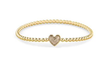 Flexibele as armband met hart als compartiment voor as of haar, gedenksieraden. Transparent