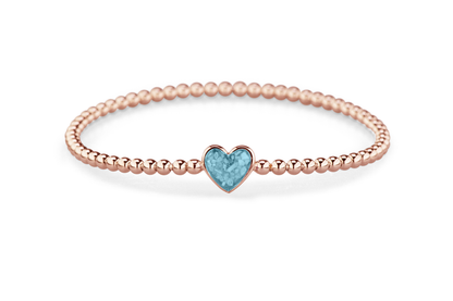 Flexibele as armband met hart als compartiment voor as of haar, gedenksieraden. Baby