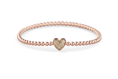 Flexibele as armband met hart als compartiment voor as of haar, gedenksieraden. Transparent