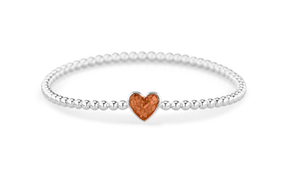 Flexibele as armband met hart als compartiment voor as of haar, gedenksieraden. Orange
