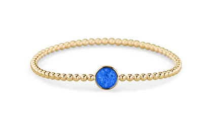Flexibele as armband met rondje als compartiment voor as of haar, gedenksieraden. Blue