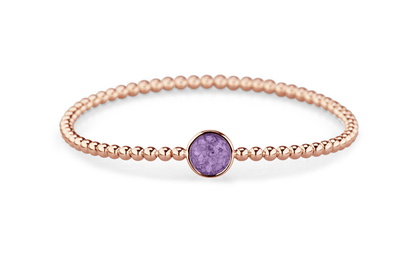 Flexibele as armband met rondje als compartiment voor as of haar, gedenksieraden. Purple