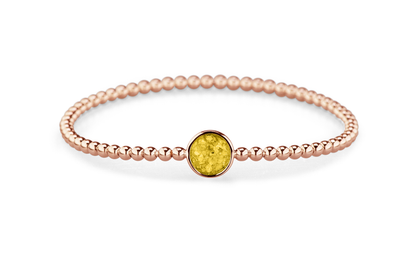 Flexibele as armband met rondje als compartiment voor as of haar, gedenksieraden. Yellow