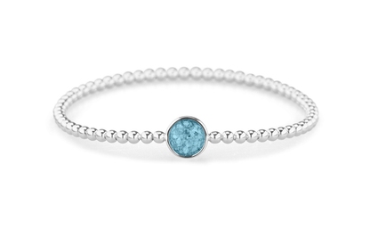 Flexibele as armband met rondje als compartiment voor as of haar, gedenksieraden. Baby
