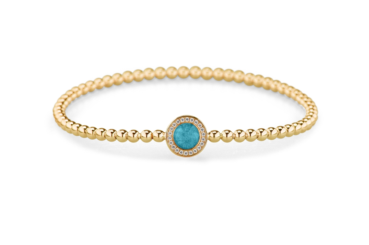 Flexibele as armband met rondje als compartiment gezet rondom met zirconia's voor as of haar. Turquoise