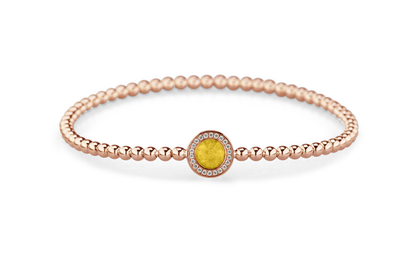 Flexibele as armband met rondje als compartiment gezet rondom met zirconia's voor as of haar. Yellow