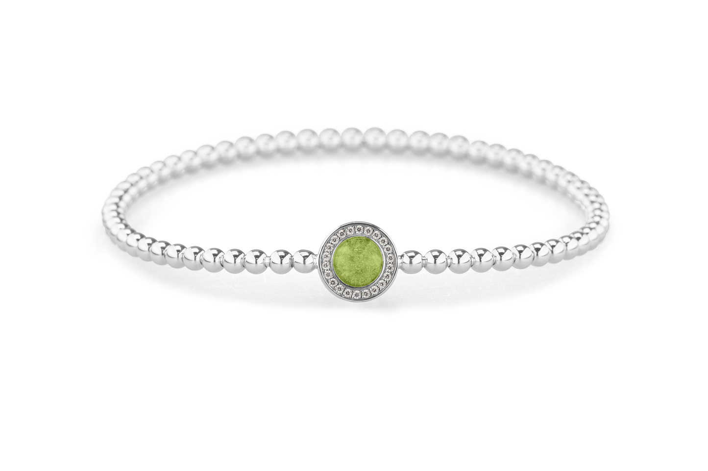 Flexibele as armband met rondje als compartiment gezet rondom met zirconia's voor as of haar. Green