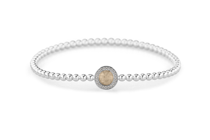 Flexibele as armband met rondje als compartiment gezet rondom met zirconia's voor as of haar. Transparent