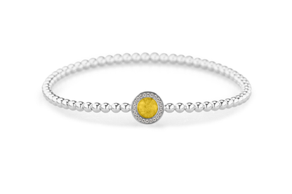 Flexibele as armband met rondje als compartiment gezet rondom met zirconia's voor as of haar. Yellow