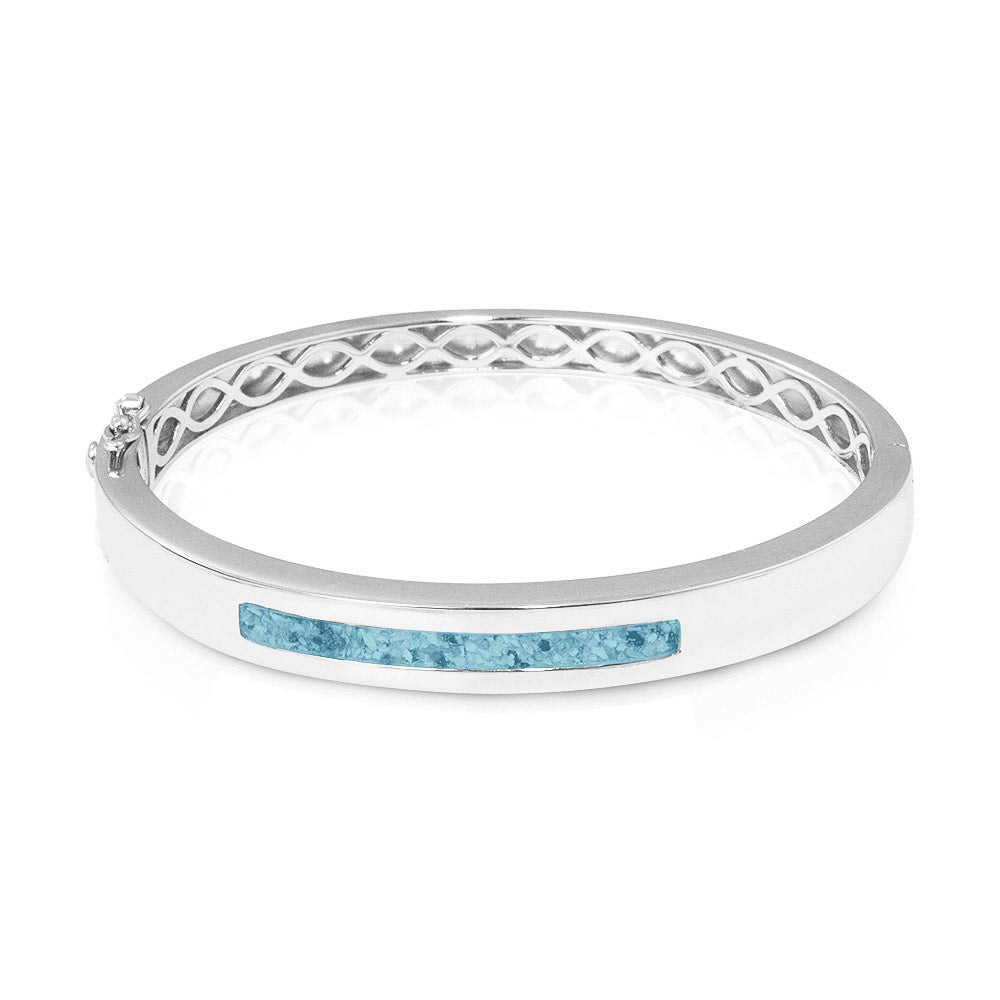 Zilveren as armband die  gevuld kan worden met as of haar. Baby