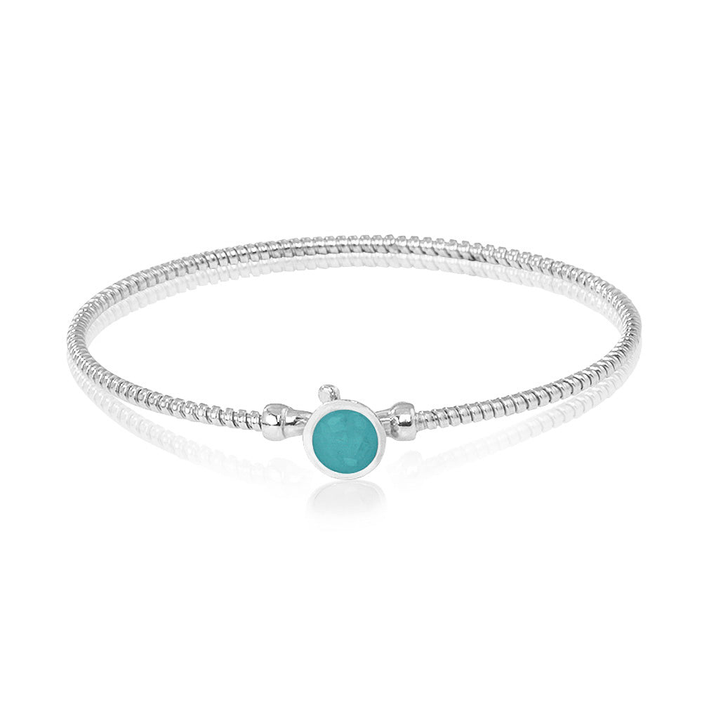 Zilveren as armband met in het midden een ornamentje, gedenksieraad. Aqua