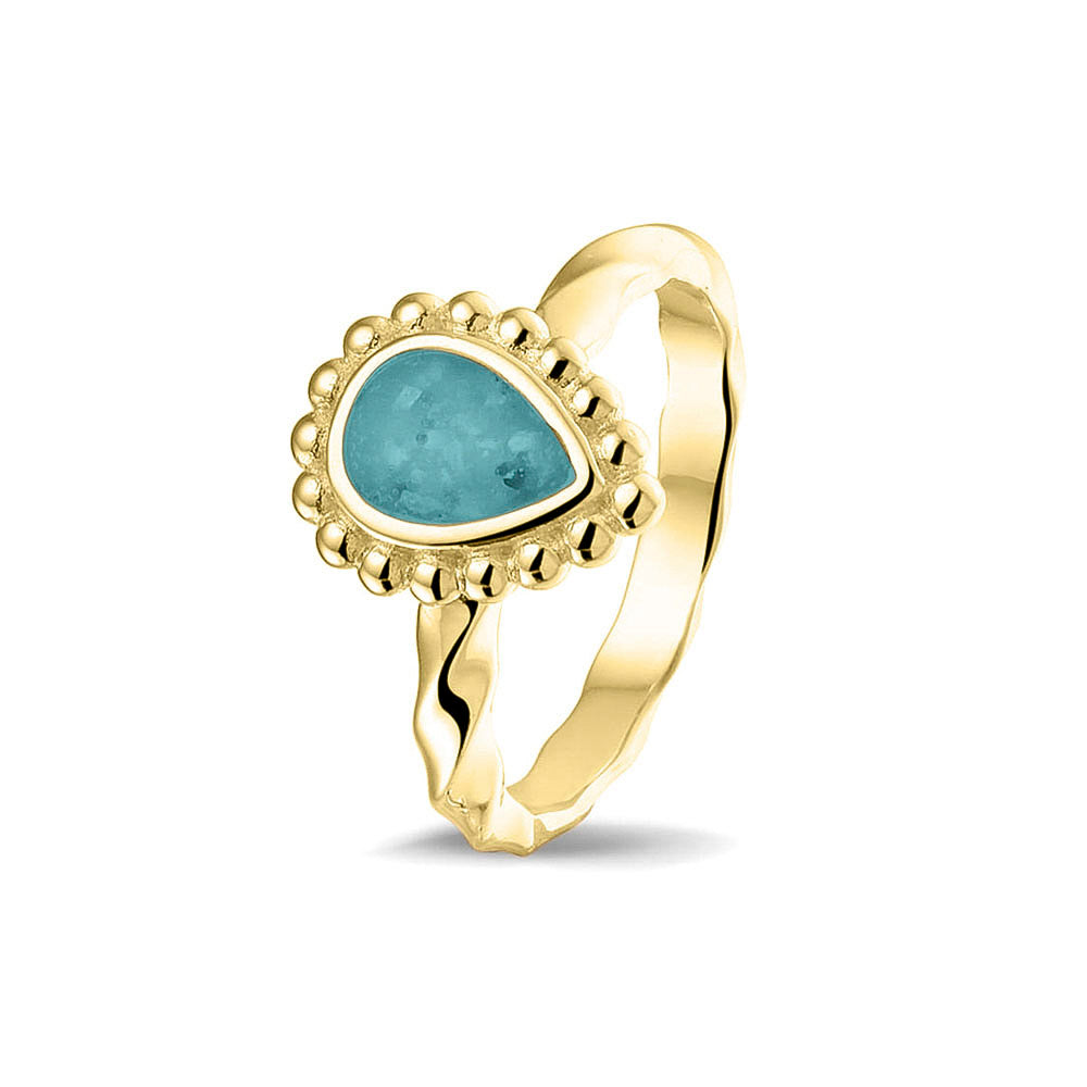 Gedenksieraad, asring met gedraaide scheen waar aan de bovenzijde in druppelvorm met parelrand zichtbaar as of haar (of eventueel melktandjes of moedermelk) verwerkt wordt.aqua