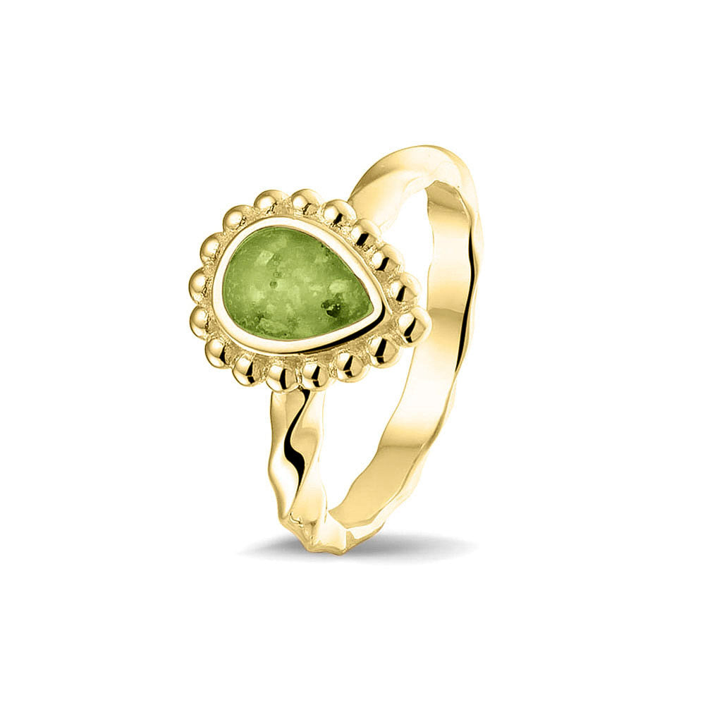 Gedenksieraad, asring met gedraaide scheen waar aan de bovenzijde in druppelvorm met parelrand zichtbaar as of haar (of eventueel melktandjes of moedermelk) verwerkt wordt.green