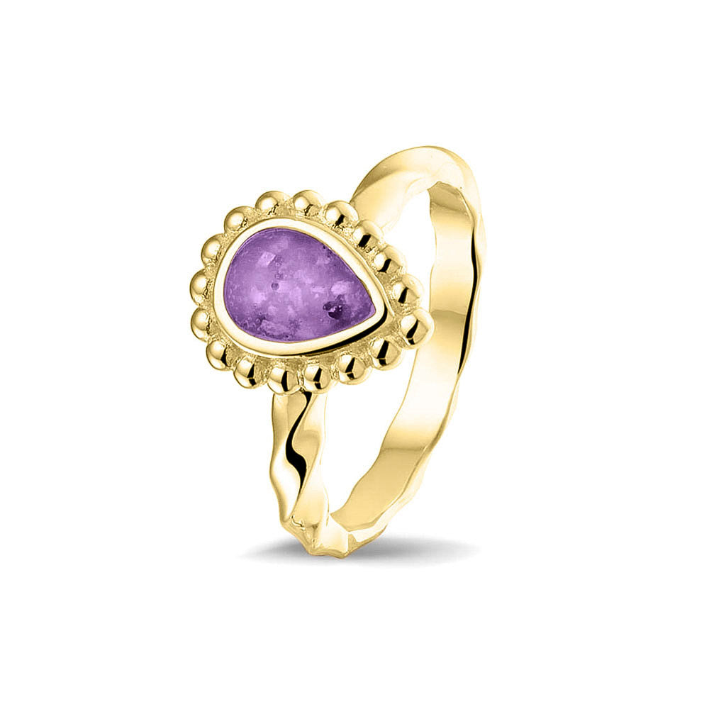 Gedenksieraad, asring met gedraaide scheen waar aan de bovenzijde in druppelvorm met parelrand zichtbaar as of haar (of eventueel melktandjes of moedermelk) verwerkt wordt.purple