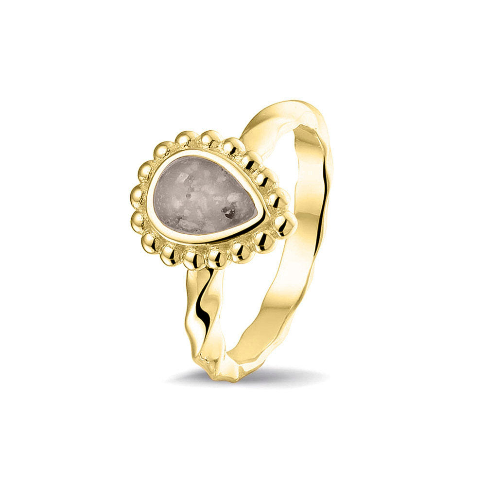 Gedenksieraad, asring met gedraaide scheen waar aan de bovenzijde in druppelvorm met parelrand zichtbaar as of haar (of eventueel melktandjes of moedermelk) verwerkt wordt.silver