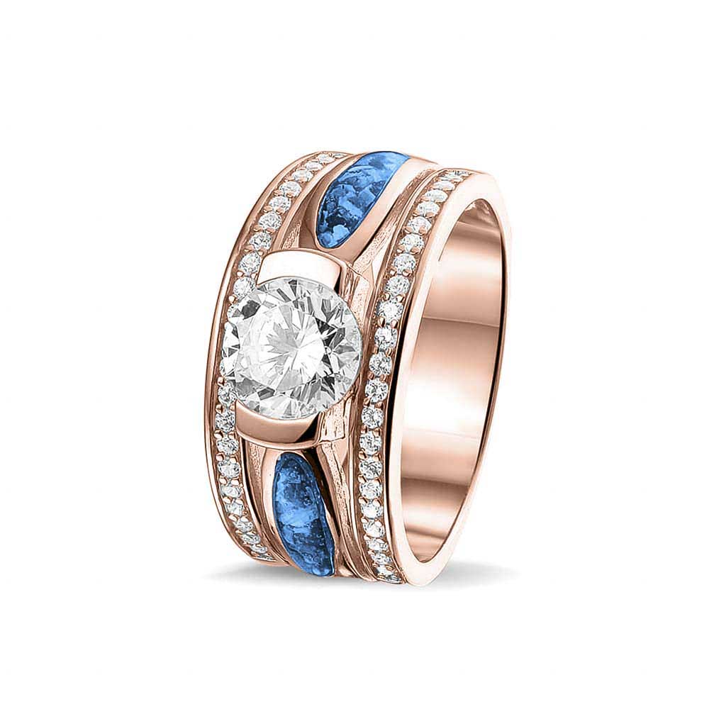 Asring 10 mm uit onze serie gedenksieraden, waar aan de bovenzijde zichtbaar as of haar verwerkt wordt in twee separate compartimenten met in het midden een zirkonia. Marine