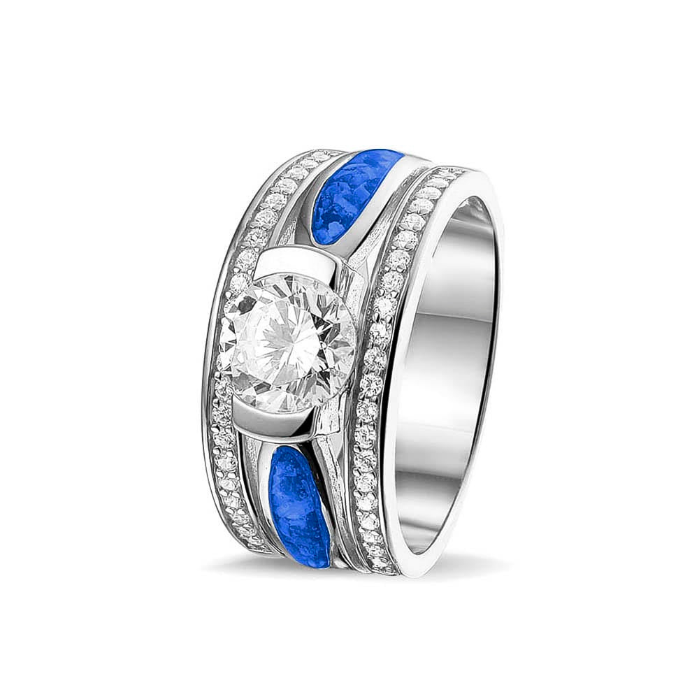 Asring 10 mm uit onze serie gedenksieraden, waar aan de bovenzijde zichtbaar as of haar verwerkt wordt in twee separate compartimenten met in het midden een zirkonia. Blue