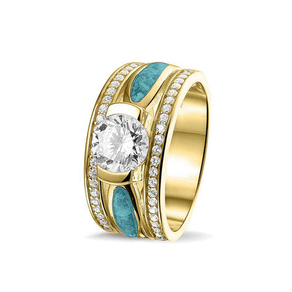 Asring 10 mm uit onze serie gedenksieraden, waar aan de bovenzijde zichtbaar as of haar verwerkt wordt in twee separate compartimenten met in het midden een zirkonia. Aqua