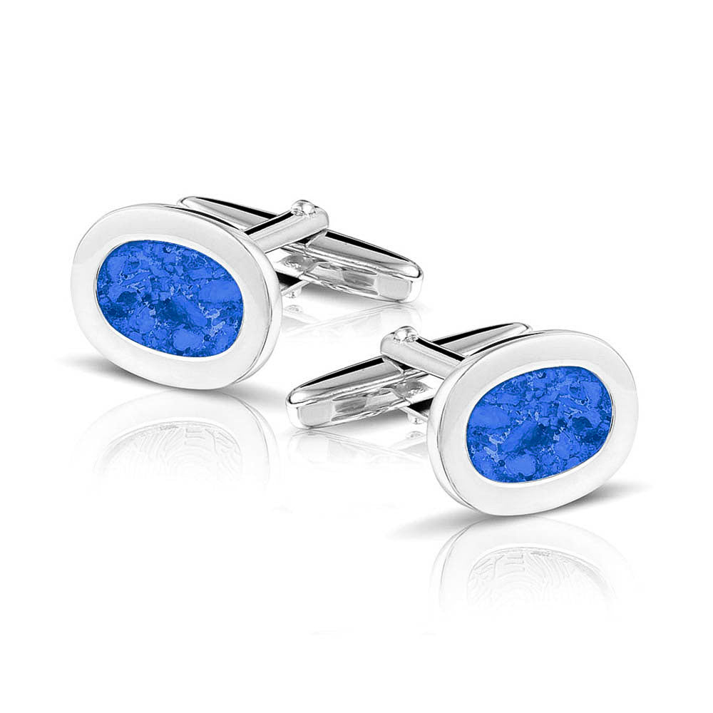 Manchetknopen met as, zichtbaar gevuld, als herinneringssieraad. blue