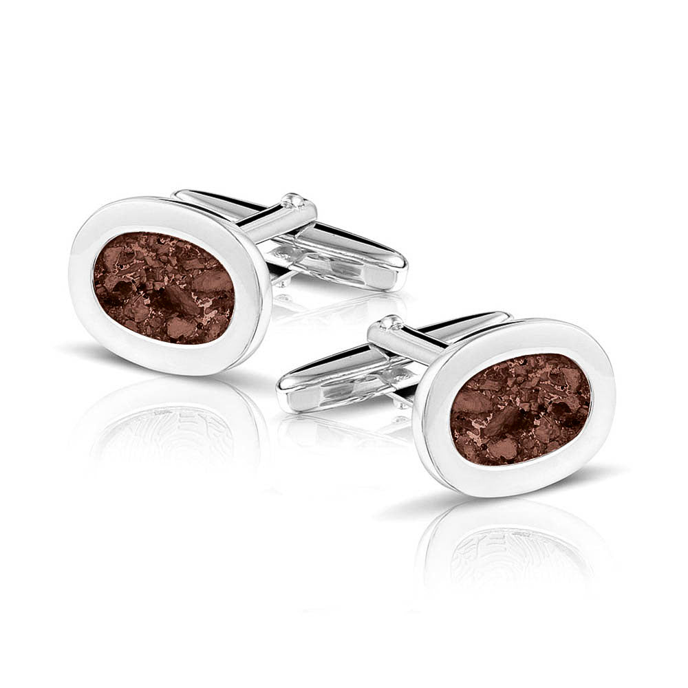 Manchetknopen met as, zichtbaar gevuld, als herinneringssieraad. brown