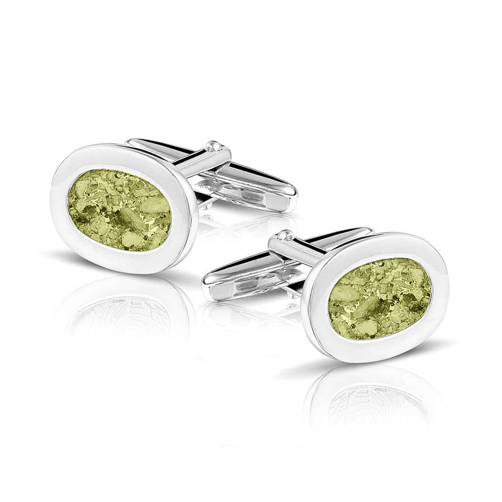 Manchetknopen met as, zichtbaar gevuld, als herinneringssieraad. olive