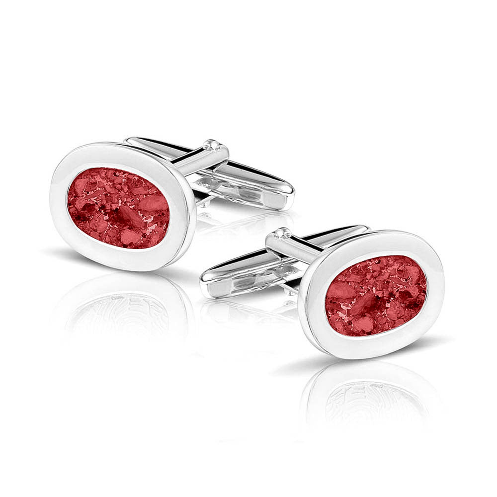 Manchetknopen met as, zichtbaar gevuld, als herinneringssieraad. red