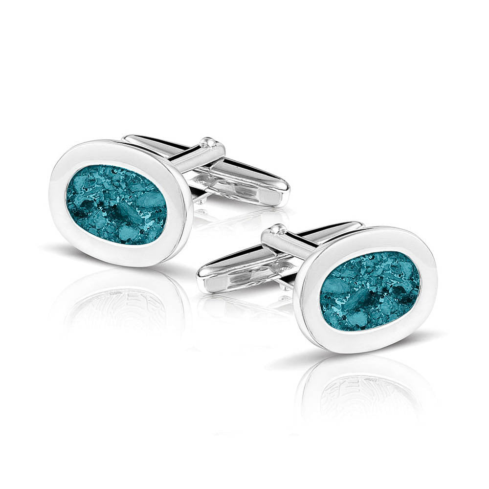 Manchetknopen met as, zichtbaar gevuld, als herinneringssieraad. turquoise